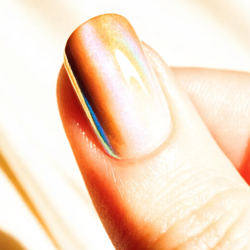 Macro close-up of a pearlescent glazed chrome nail